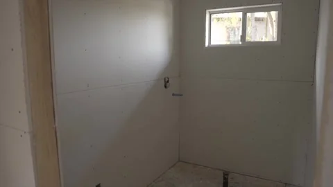 Panning drywall in construction site Stock Footage 303641329