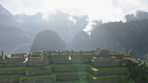 Panning of empty Machu Picchu lost city in sunny day. Majestic modern Stock Footage 286347384