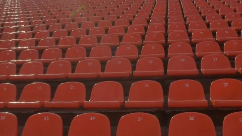 Panning of empty stadium seats, stadium without spectators. Stock Footage 128485713