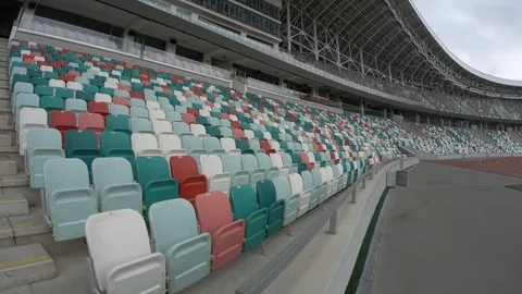 Panning of empty stadium seats, stadium without spectators. Video stock 129585446
