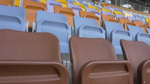 Panning of empty stadium seats, stadium without spectators. Video stock 129733538