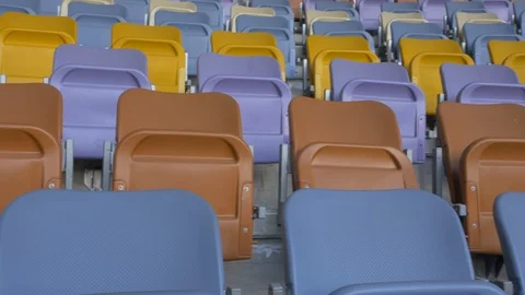 Panning of empty stadium seats, stadium without spectators. Video stock 129733563