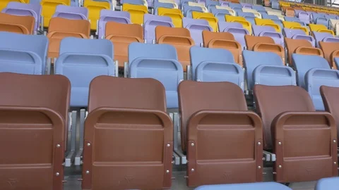 Panning of empty stadium seats, stadium without spectators. Stock Footage 129733594