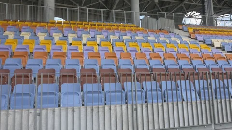 Panning of empty stadium seats, stadium without spectators. Stock Footage 129733597
