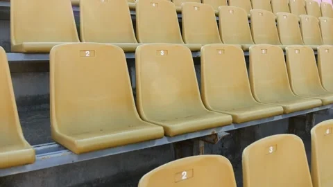 Panning of empty stadium seats, stadium without viewers. Video stock 155951033