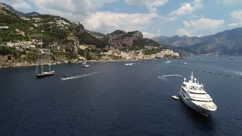 Panning footage with yacht on coast of Amalfi Italy. Stock Footage