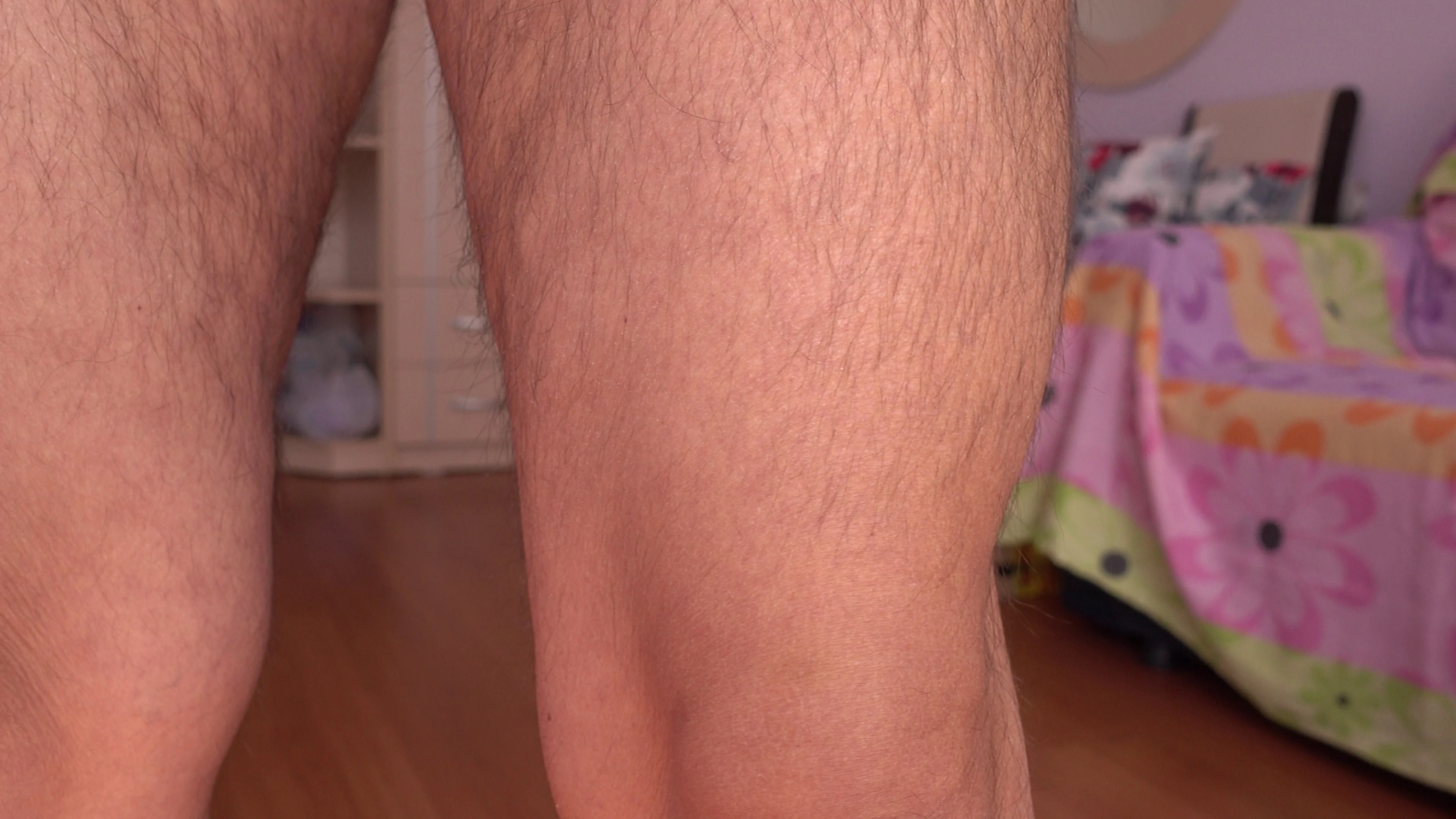 Panning hairy thighs of a woman