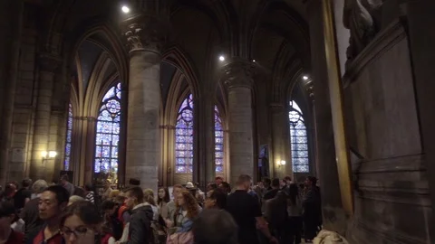 Panning inside Notre Dame Cathedral crowded people beautiful interior Paris Stock-Footage 94428117