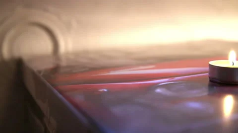 Panning of an isolated candle in a abstract background Stock-Footage 55630630