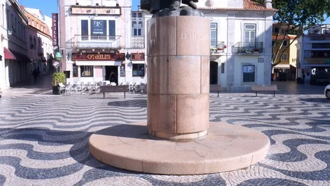 Panning up of King Peter I Statue in Outubro Square, historic Cascais center Stock Footage 108550451