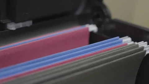 Panning left across the files in cabinet. Stock Footage 331743364