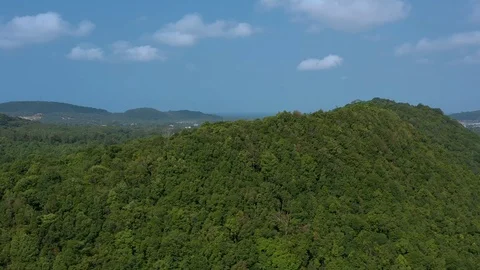 Panning left around mountains with forest in sunny day with cloudy sky in Phu Qu Stock Footage 124326210