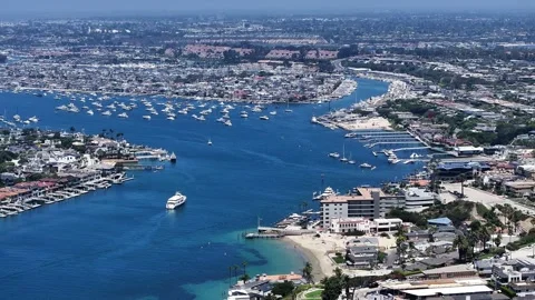 Panning left from Corona del Mar across Balboa island to Balboa Peninsula Stock Footage 340075774
