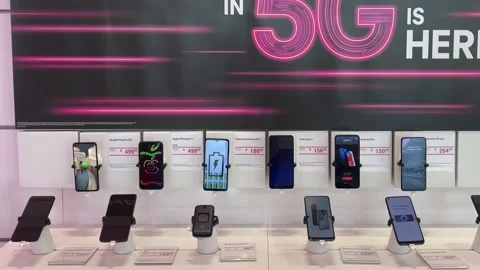 Panning left on a display of Google, Apple, Samsung, Moto, OnePlus, Alcatel,  Stock Footage 163992620