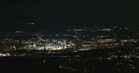 Panning left on the night view of Ueda city in Nagano, Japan Stock Footage 334680231