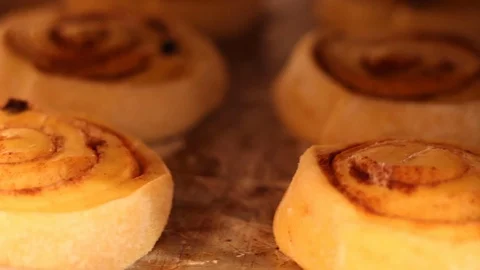Panning left to right of cinnamon rolls on tray Stock Footage 130084702