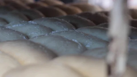 Panning left to right of raw dough ready for baking Vídeos de archivo 130092636
