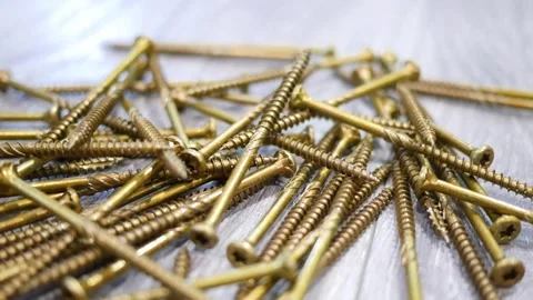 Panning left of screws all over the floor Видео 246841151
