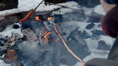 Panning to left shot of two guys grilling hotdogs Stock Footage 233546504