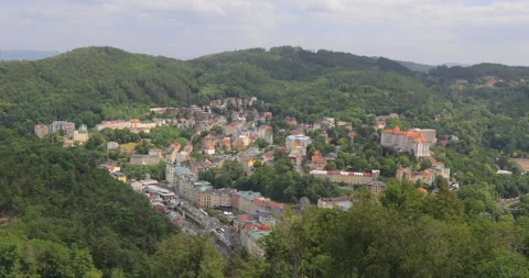 Panning left view of city centre and moiuntains at Karlovy Vary from lookout Stock Footage 337805921