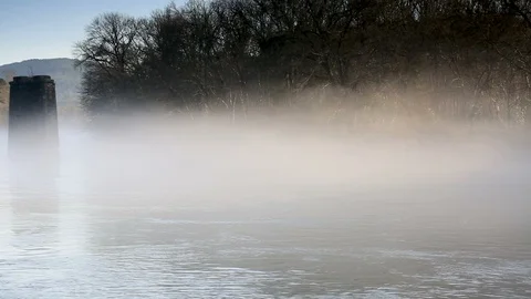 Panning left view of two stone pillars in river. Stock Footage 85957995