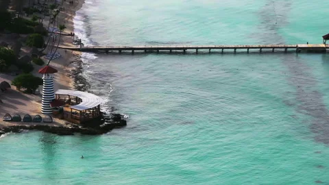 Panning of lighthouse typical pier and turquoise Caribbean sea close-up view Stock Footage 281624551