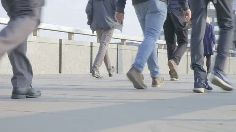 Panning low angle view of commuter legs at rush hour Video stock 106901000