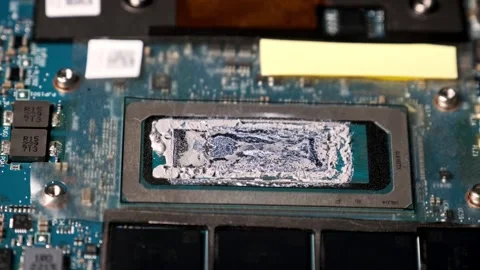 Panning Macro View of a CPU Core with Applied Thermal Compound Stock Footage 314134689
