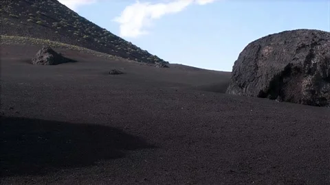 Panning medium shot of volcanic soil and rocks. Lanzarote, Timanfaya, 4k Stock Footage 154553624