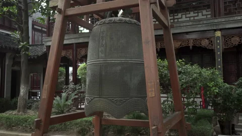 Panning: Metallic bell with Chinese script at Buddhist temple - Suzhou, China Stock Footage 149664671