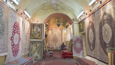 Panning motion inside carpet shop at Vakil Bazaar, Shiraz, Iran Stock Footage 100738005