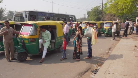 Panning motion of parked auto rickshaws in Agra, India Stock Footage 101411946
