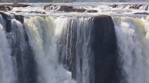 Panning motion of water cascading over Victoria Falls, Zimbabwe, Africa Vídeo Stock 140620464