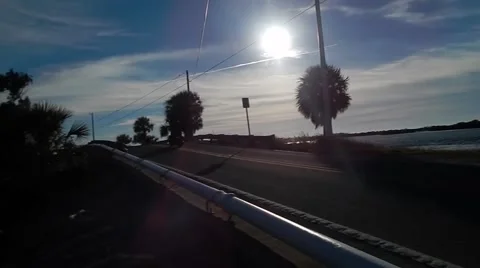 Panning motorcycle riding by through sunset Vídeos de archivo 45288631