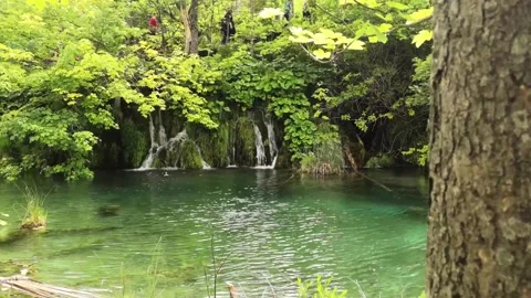Panning movement show of a small beautiful tranquil waterfall in the plitvice Stock Footage 131869041