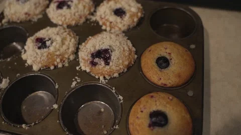 Panning muffins in baking pan Stock Footage 167809990