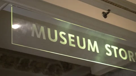 Panning museum store sign Stock Footage 154482998