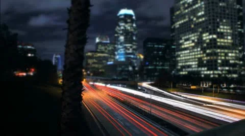 Panning Night Timelapse of City Traffic on Downtown Los Angeles Freeway Stock Footage 12560460