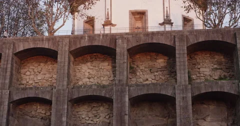 Panning of old brick wall protecting church standing close to douro river Stock Footage 155253782