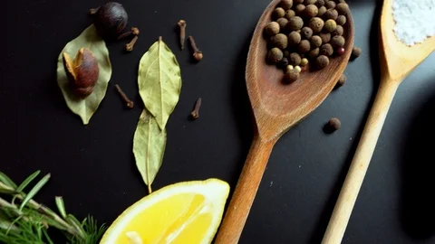 Panning over assorted culinary herbs and spices Stock Footage 105132667