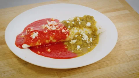 Panning Over a Burrito Smothered in Chile Sauce Stock Footage 141015052