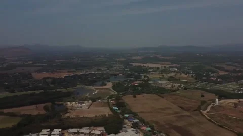 Panning over field with mountain view Khao Yai, Thailand Stockbeeldmateriaal 148847371