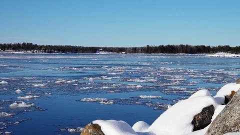 Panning over floating in Baltic sea ice floes, Swedish coast,Umea city Stock Footage 128700817