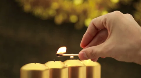 Panning over hand lighting christmas candles Stock-Footage 30582239
