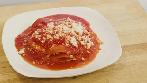 Panning Over a Plate of Red Enchiladas Stock Footage 141026944