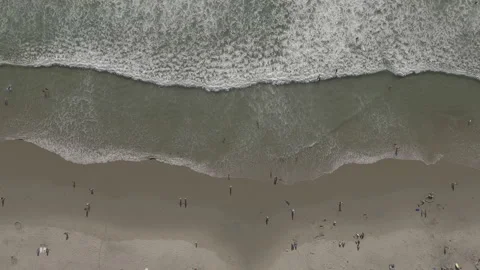 Panning over rolling waves along the coast Stock Footage 157132603