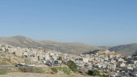 Panning over the rooftops of a mountain town Stock Footage 123987934
