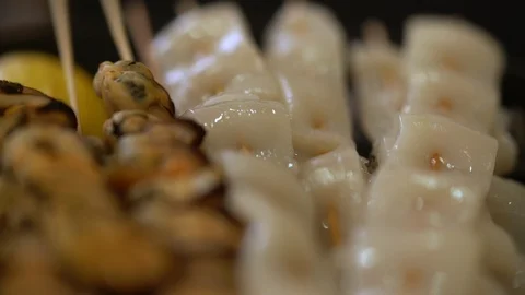 Panning over a selection of seafood kebabs Stock Footage 115077163