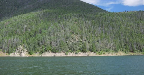 Panning Over a Tranquil Mountain Lake - 4K Stock Footage 66525054