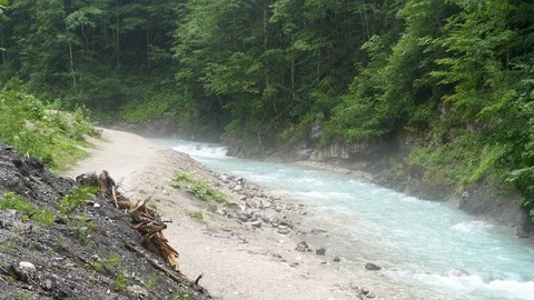 Panning over a wild river in the Alps Stock Footage 121006712